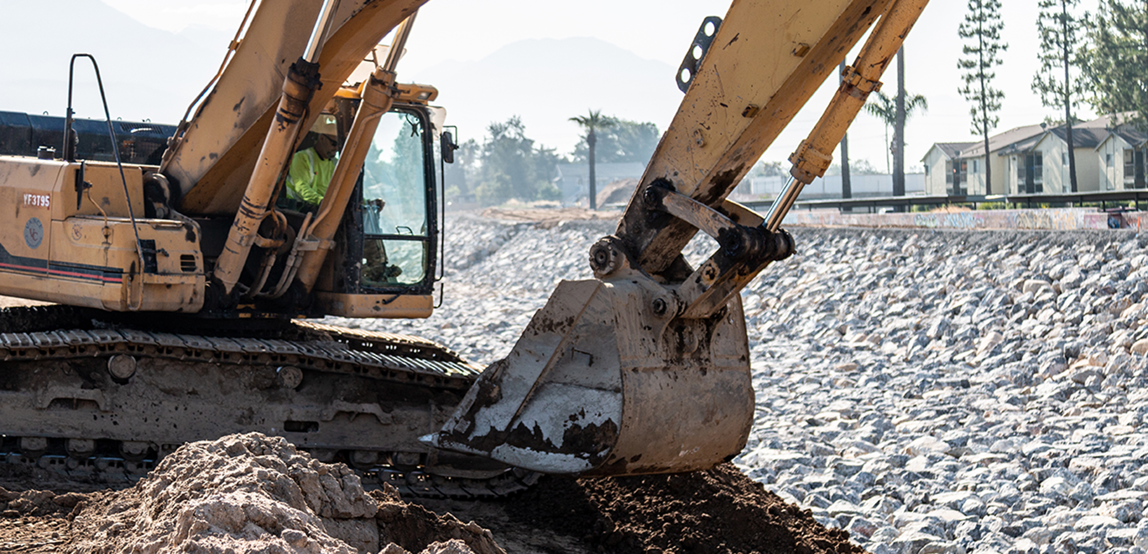 Excavator digging a hole