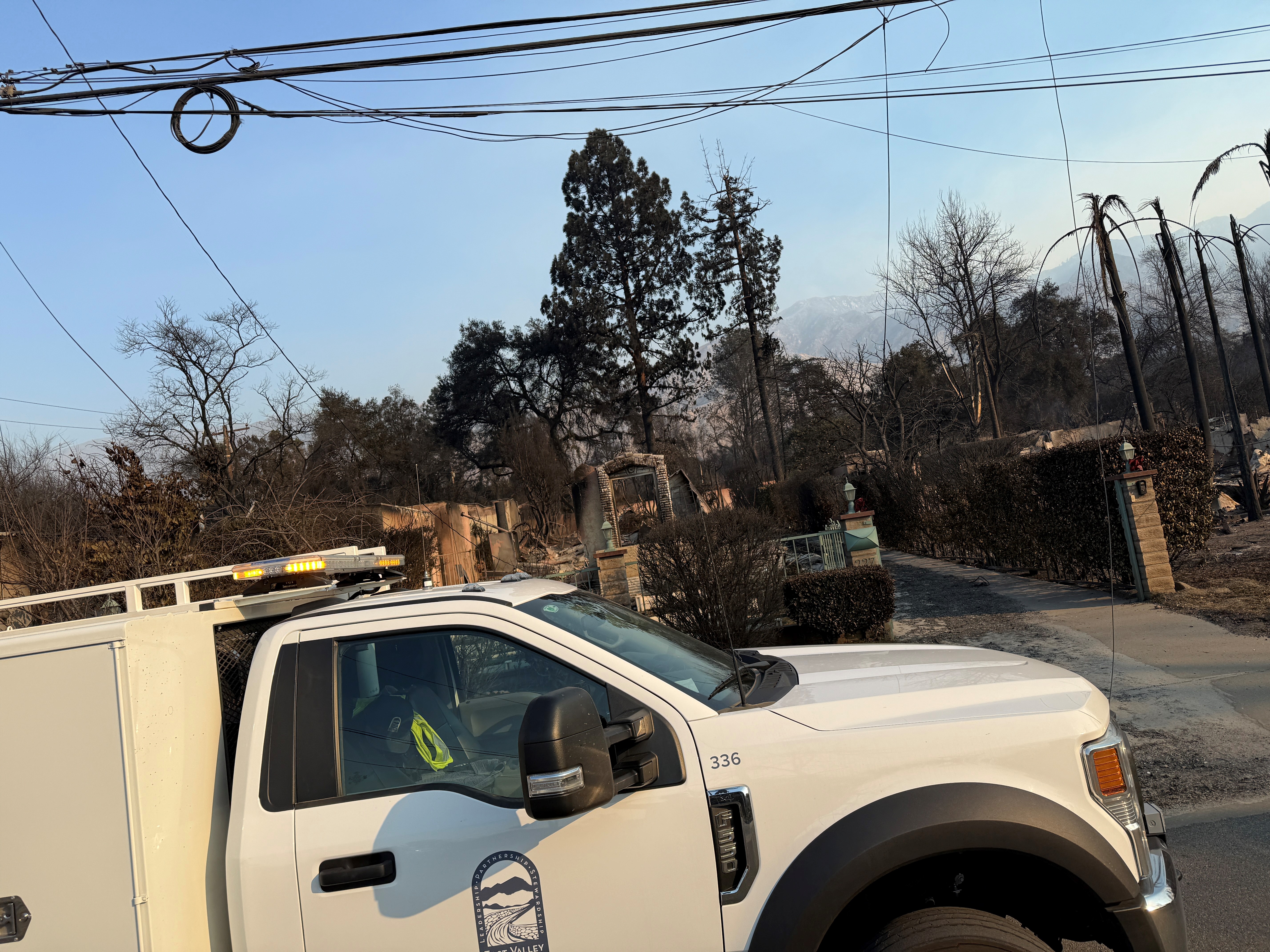 EVWD truck in front of a burned down home. 