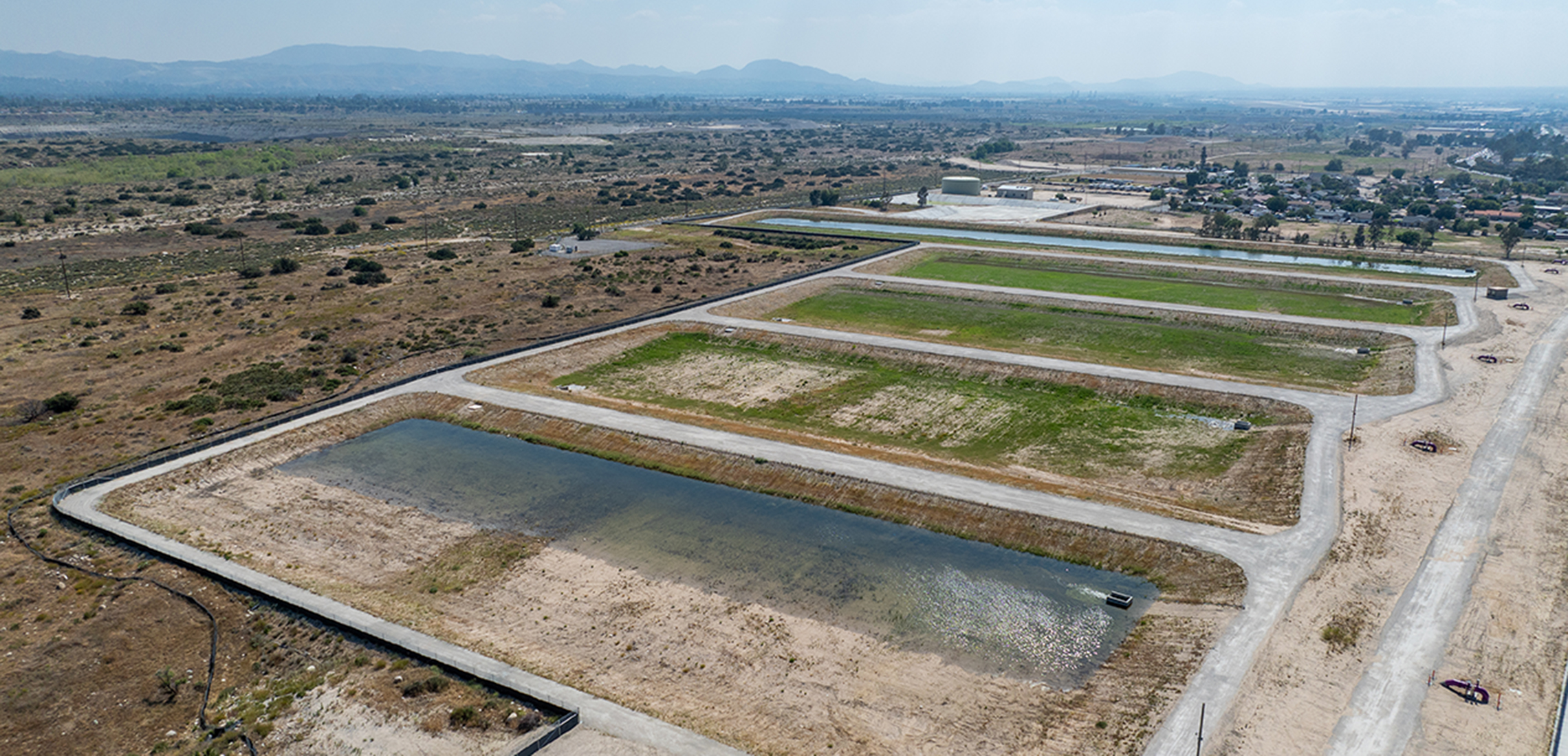 Five large recharge basins with one partially filled with water