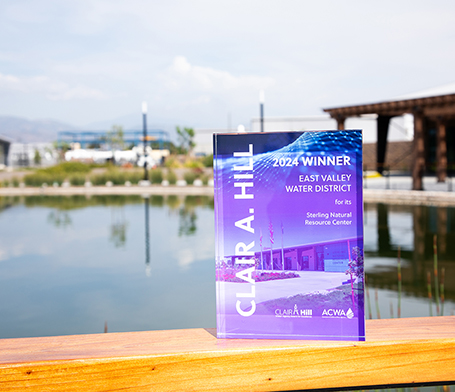 Award on railing of pond.  The award reads: Clair A. Hill 2024 Winner East Valley Water District for it's Sterling Natural Resource Center.